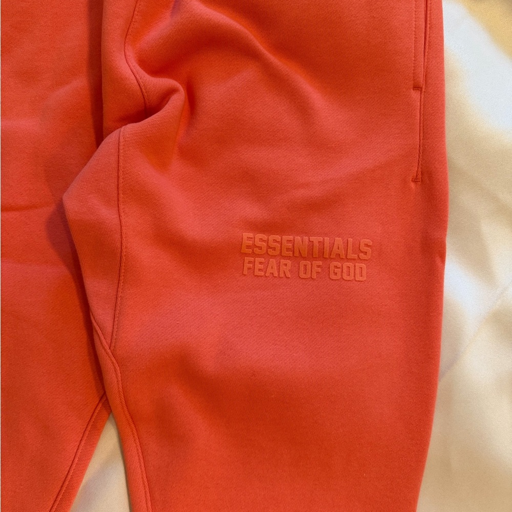 FEAR OF GOD ESSENTIALS - Tapered Logo Blend Jersey Sweatpants in Coral - Picture 7 of 11